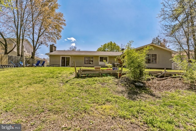 3600 Yorktown Dr, Waldorf, MD 20601 - rear view of house featuring a chimney, fence, and a lawn