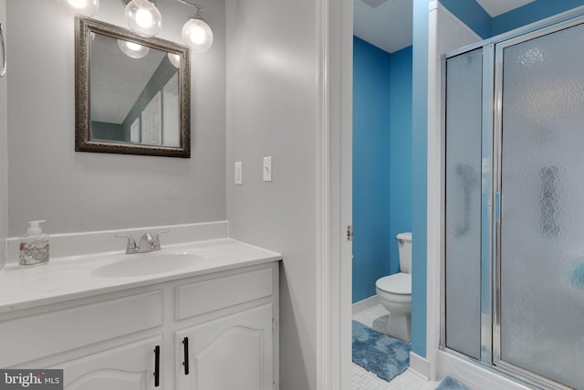 3600 Yorktown Dr, Waldorf, MD 20601 - bathroom featuring tile patterned flooring, toilet, a shower stall, and vanity