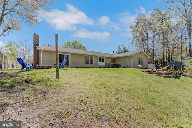 3600 Yorktown Dr, Waldorf, MD 20601 - back of property featuring a yard, fence, and a chimney
