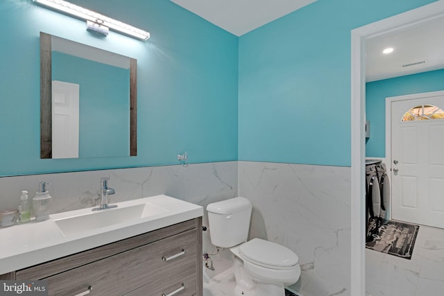 3600 Yorktown Dr, Waldorf, MD 20601 - bathroom with separate washer and dryer, marble finish floor, visible vents, and wainscoting