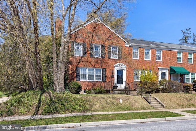 view of front of property with brick siding