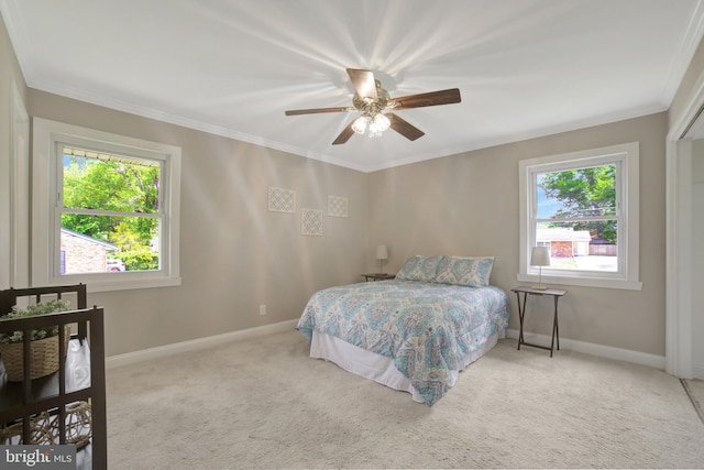 bedroom with multiple windows, baseboards, carpet flooring, and ornamental molding