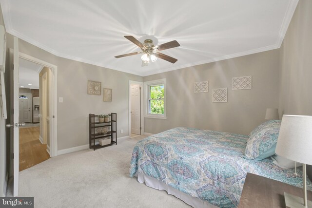 bedroom with carpet floors, baseboards, crown molding, stainless steel fridge, and a ceiling fan