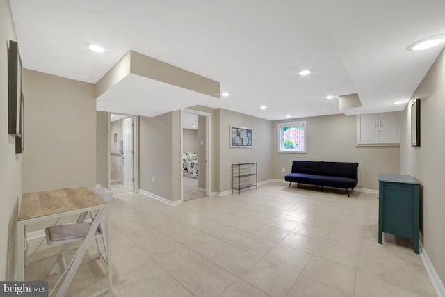 living area with light tile patterned flooring, baseboards, and recessed lighting