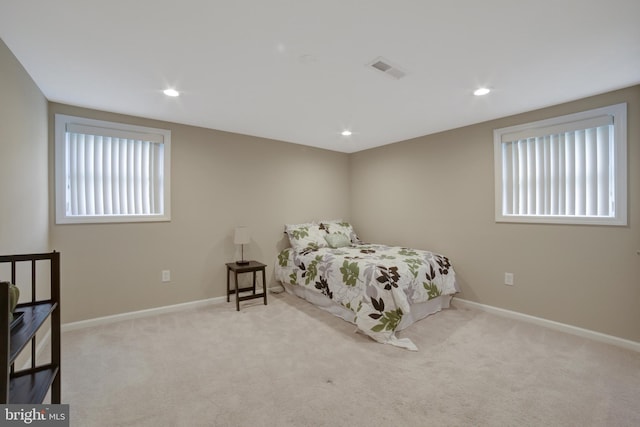 carpeted bedroom with baseboards and recessed lighting