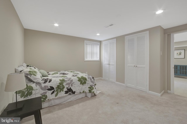 bedroom with multiple closets, carpet floors, recessed lighting, and baseboards
