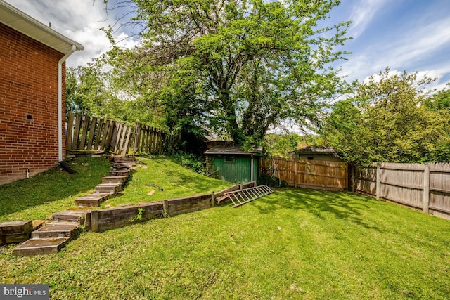 view of yard with an outbuilding and a shed