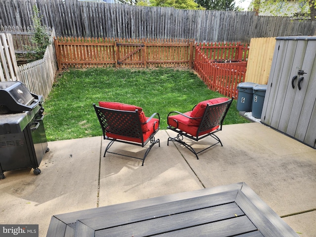 view of patio / terrace featuring a fenced backyard and a grill