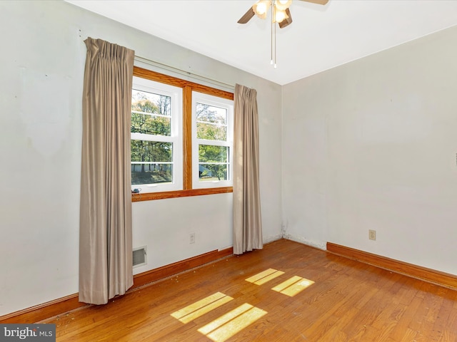 268 Magothy Bridge Rd, Pasadena, MD 21122 - unfurnished room featuring visible vents, light wood finished floors, ceiling fan, and baseboards