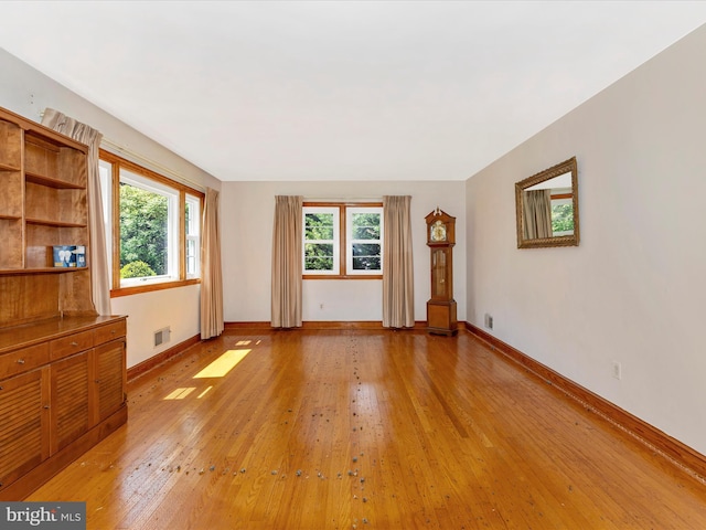 268 Magothy Bridge Rd, Pasadena, MD 21122 - unfurnished living room featuring light wood-style floors, baseboards, and visible vents
