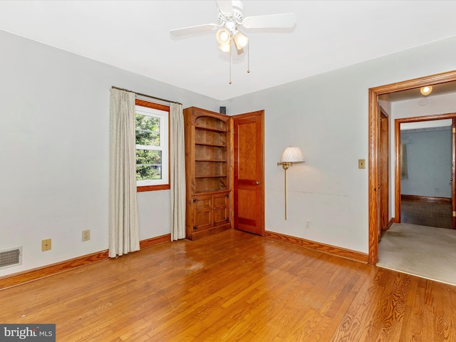 268 Magothy Bridge Rd, Pasadena, MD 21122 - unfurnished room with visible vents, a ceiling fan, light wood-style floors, and baseboards