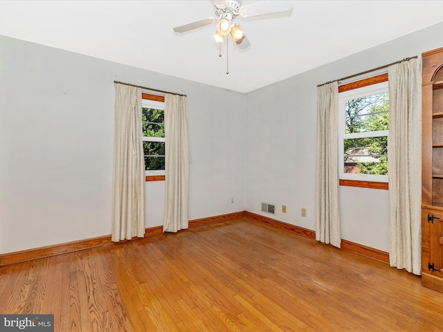 268 Magothy Bridge Rd, Pasadena, MD 21122 - unfurnished room featuring baseboards, a wealth of natural light, and light wood finished floors