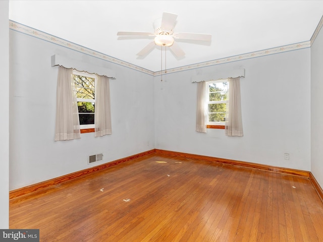 268 Magothy Bridge Rd, Pasadena, MD 21122 - empty room with baseboards, a wealth of natural light, wood-type flooring, and visible vents