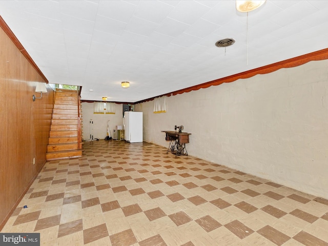 268 Magothy Bridge Rd, Pasadena, MD 21122 - finished below grade area featuring freestanding refrigerator, wooden walls, and stairway