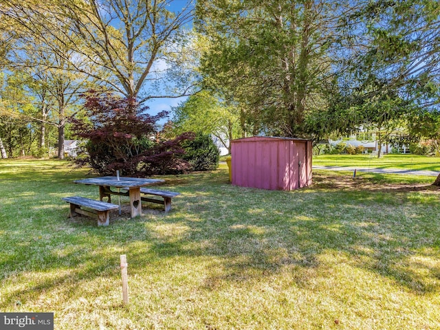 268 Magothy Bridge Rd, Pasadena, MD 21122 - view of yard with a storage unit and an outbuilding