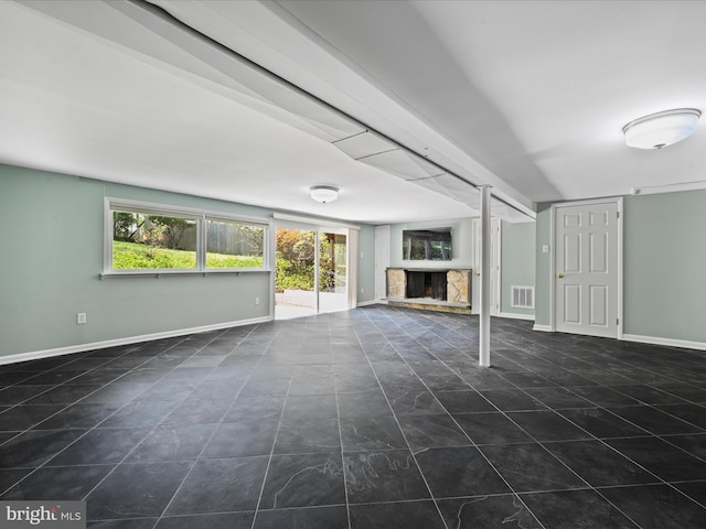 694 Trowill Ln, Wayne, PA 19087 - unfurnished living room featuring a stone fireplace and baseboards