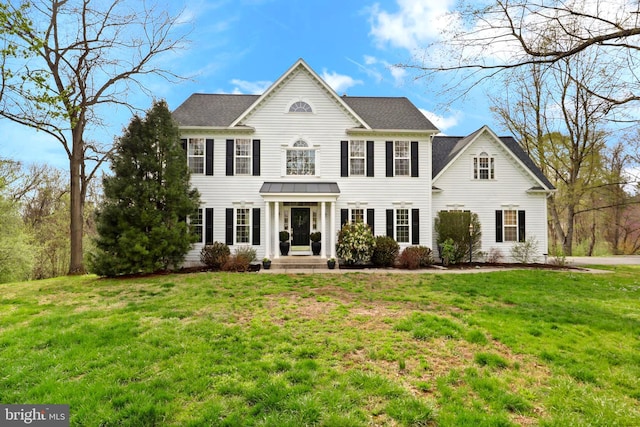 colonial-style house with a front lawn