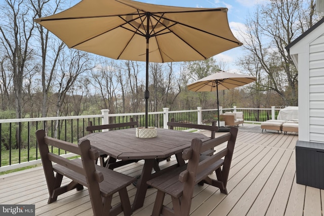 wooden deck with outdoor dining space