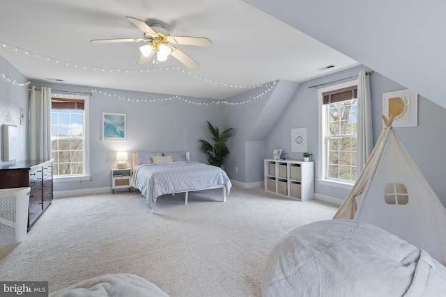 carpeted bedroom featuring baseboards and ceiling fan