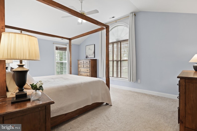carpeted bedroom featuring vaulted ceiling, baseboards, and a ceiling fan