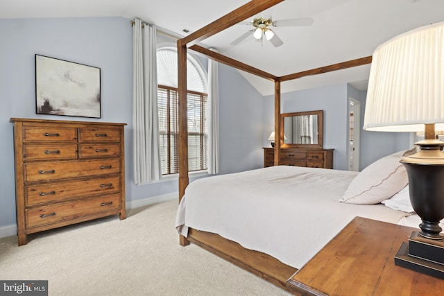 bedroom with lofted ceiling, carpet flooring, baseboards, and ceiling fan