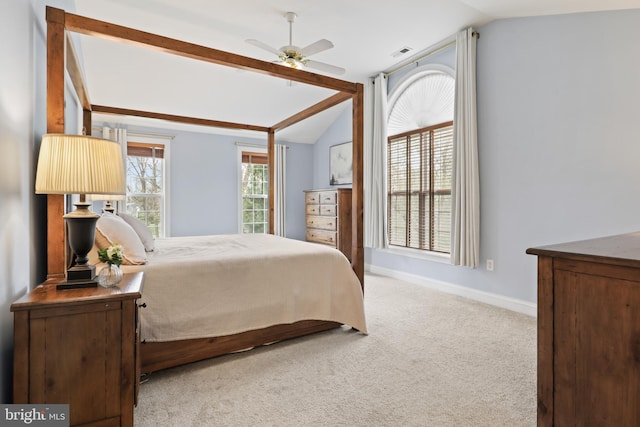 bedroom featuring lofted ceiling, carpet flooring, baseboards, and ceiling fan