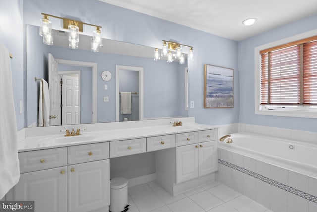 bathroom featuring tile patterned floors, double vanity, and a bath