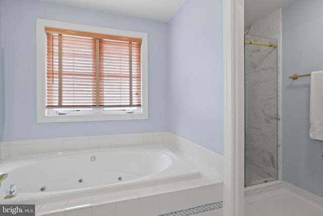 full bathroom with a shower stall and a whirlpool tub