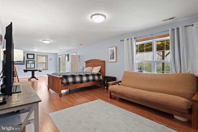 bedroom with wood finished floors