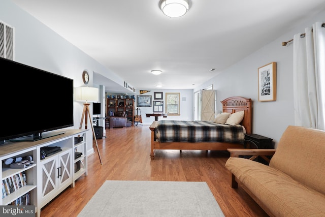 bedroom featuring light wood-style floors