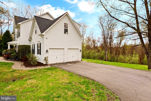 view of property exterior with driveway, an attached garage, a yard, and a shingled roof