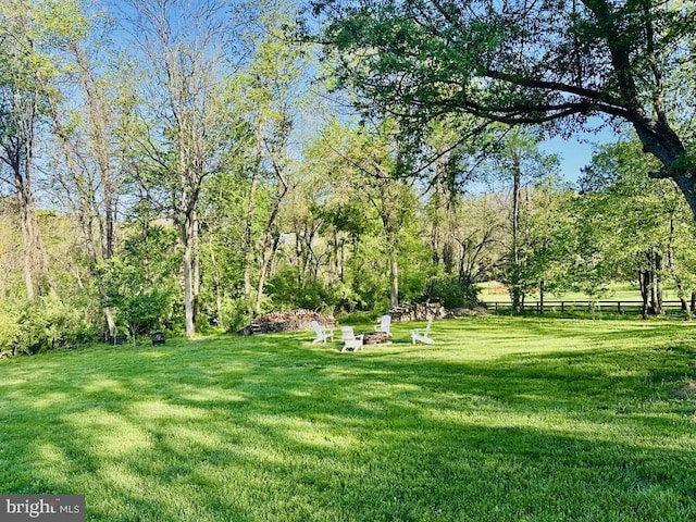 view of yard with an outdoor fire pit