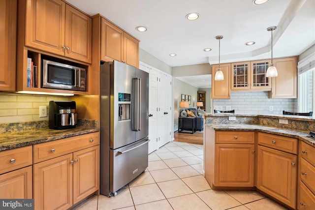 9000 Hunting Horn Ln, Potomac, MD 20854 - kitchen with stainless steel appliances, backsplash, glass insert cabinets, ornamental molding, and brown cabinetry