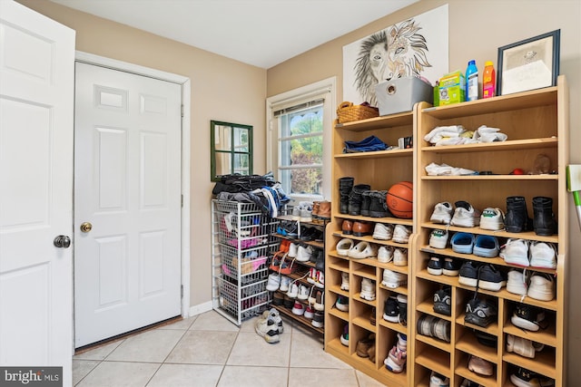 9000 Hunting Horn Ln, Potomac, MD 20854 - wine room with light tile patterned floors and baseboards