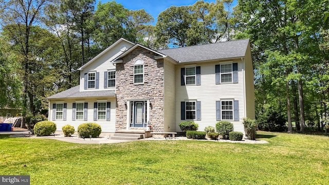 419 Kimberly Way, Felton, DE 19943 - view of front of property with stone siding, a front yard, and a shingled roof