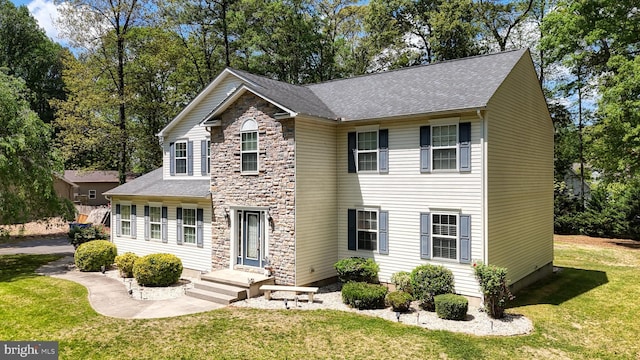 419 Kimberly Way, Felton, DE 19943 - view of front of house featuring a front lawn, roof with shingles, and stone siding