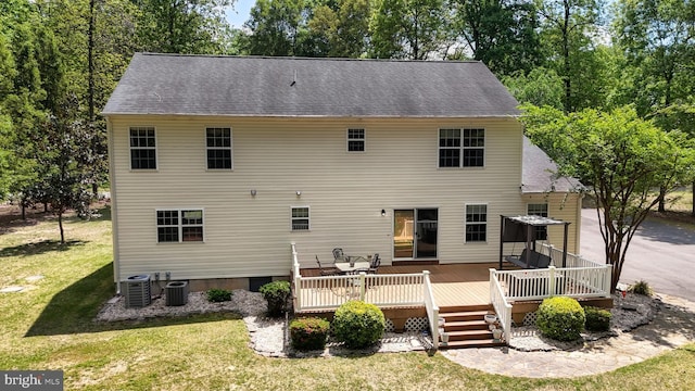 419 Kimberly Way, Felton, DE 19943 - back of property featuring a yard, central AC, roof with shingles, and a deck
