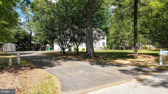 419 Kimberly Way, Felton, DE 19943 - view of front of house featuring asphalt driveway, a garage, and a front lawn