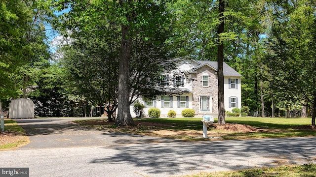419 Kimberly Way, Felton, DE 19943 - view of front of house featuring stone siding and asphalt driveway