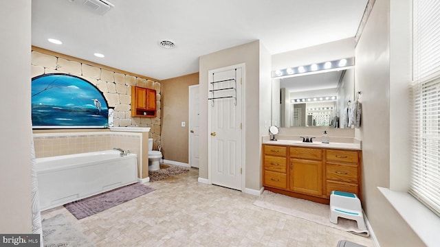419 Kimberly Way, Felton, DE 19943 - full bathroom featuring toilet, a bath, vanity, and baseboards