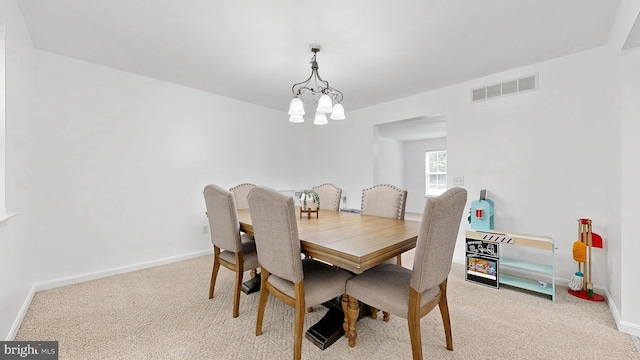 419 Kimberly Way, Felton, DE 19943 - dining room featuring a chandelier, light colored carpet, and baseboards