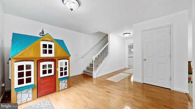 419 Kimberly Way, Felton, DE 19943 - foyer entrance featuring wood finished floors, stairway, and baseboards