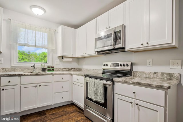 1012 Twin Vw, Glen Burnie, MD 21060 - kitchen featuring a sink, white cabinetry, appliances with stainless steel finishes, and dark wood finished floors