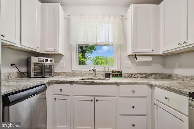 1012 Twin Vw, Glen Burnie, MD 21060 - kitchen with stainless steel dishwasher, a toaster, white cabinets, light stone counters, and a sink