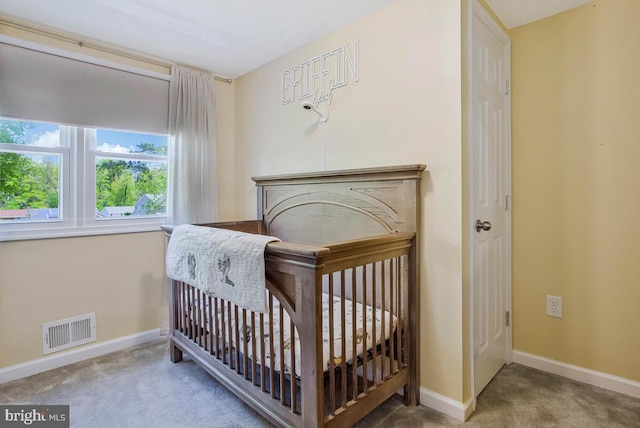 1012 Twin Vw, Glen Burnie, MD 21060 - carpeted bedroom with baseboards, visible vents, and a crib