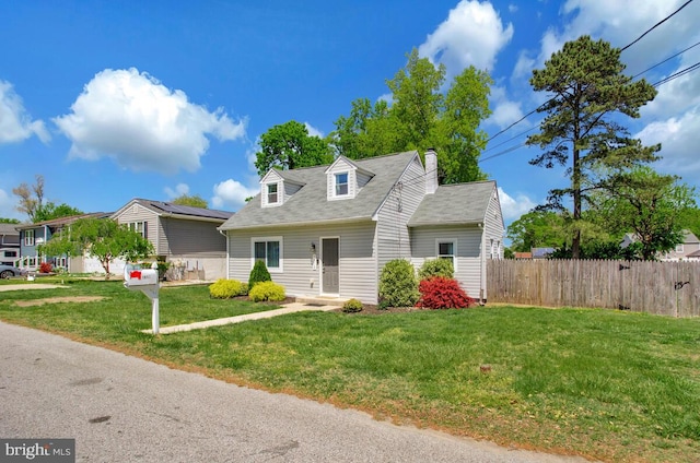 1012 Twin Vw, Glen Burnie, MD 21060 - cape cod house featuring fence, a chimney, and a front lawn