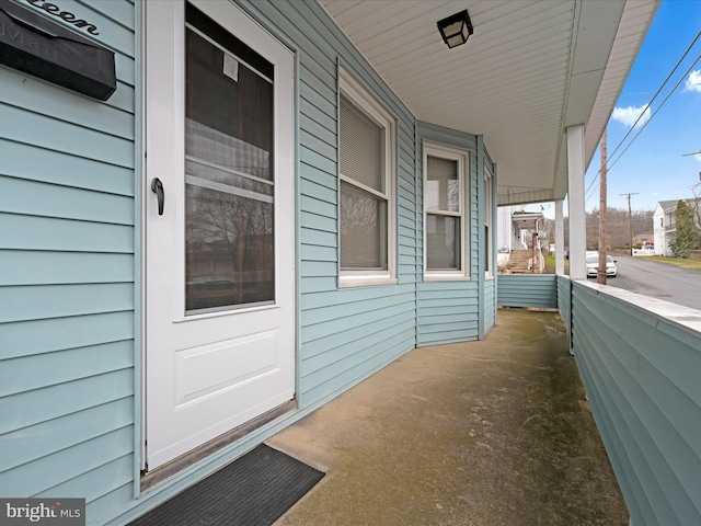 view of property exterior with a porch