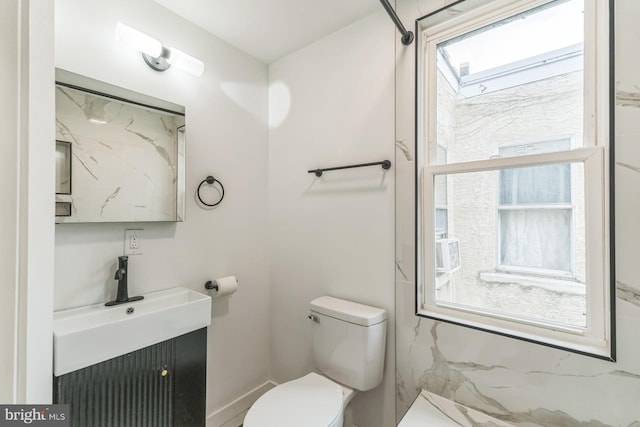 full bath with toilet and vanity