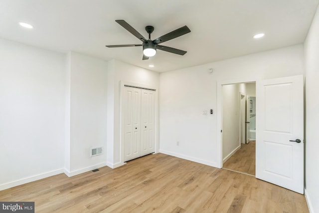 unfurnished bedroom with baseboards, light wood-style flooring, visible vents, and recessed lighting