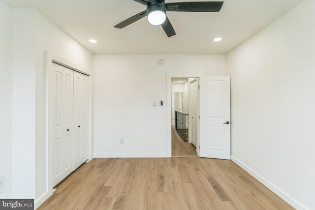 unfurnished bedroom with light wood-type flooring, baseboards, and recessed lighting